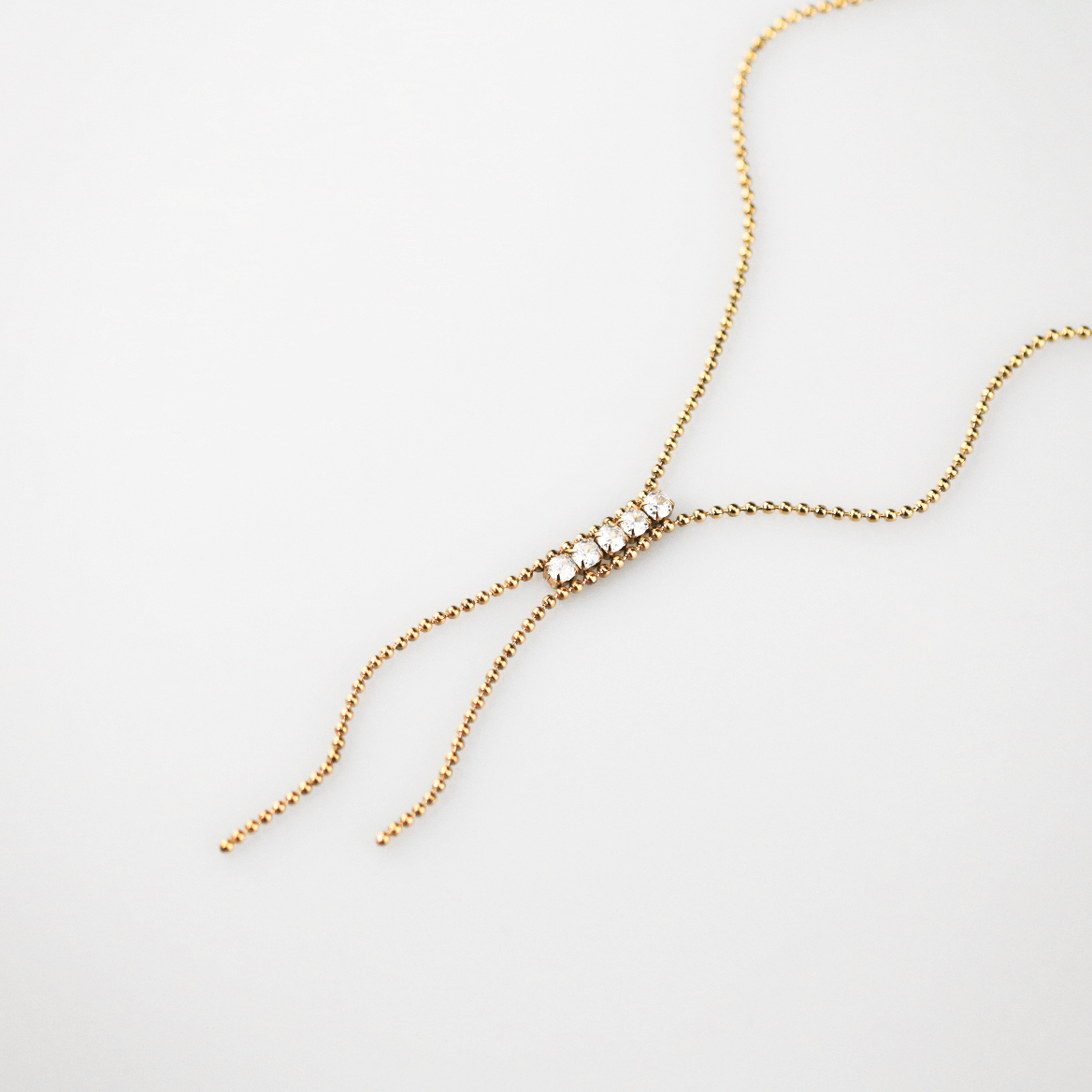 Gold lariat necklace with crystals