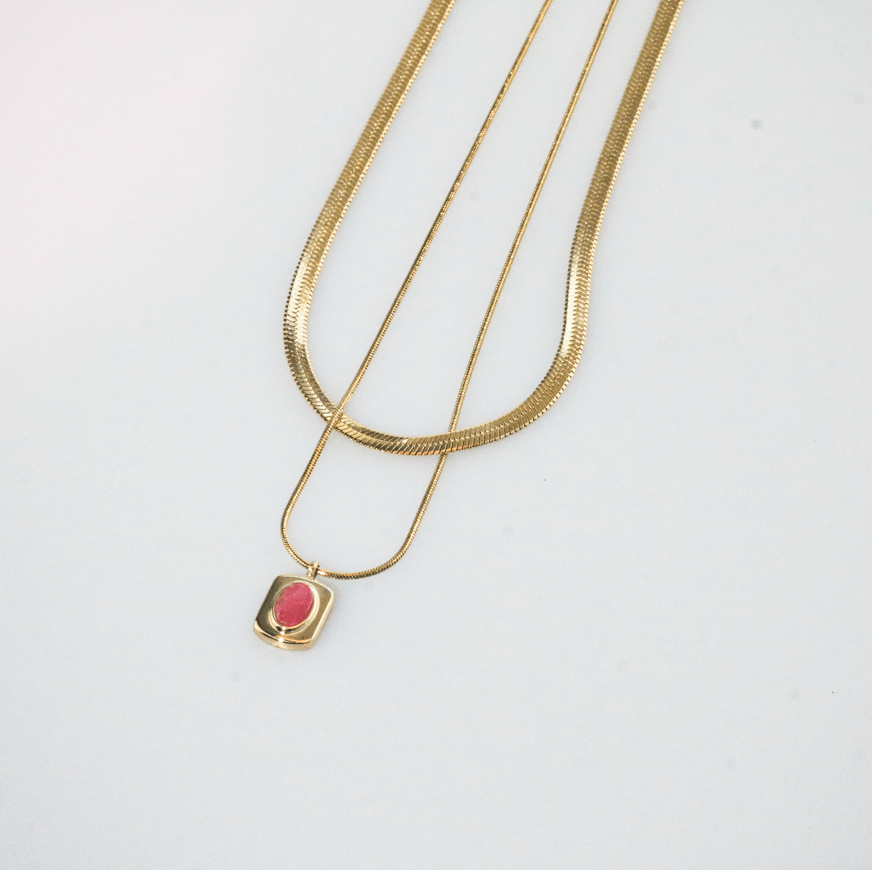 Meideya jewelry layered necklace with a pink gemstone pendant