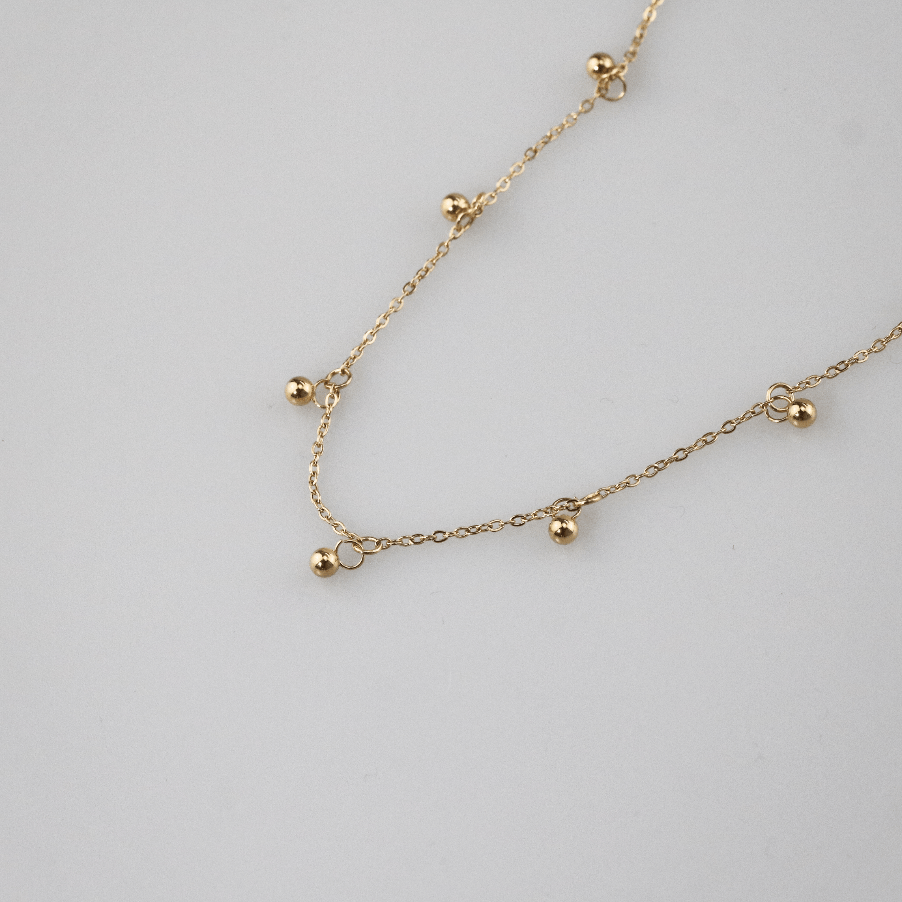 Gold Bead Station Necklace