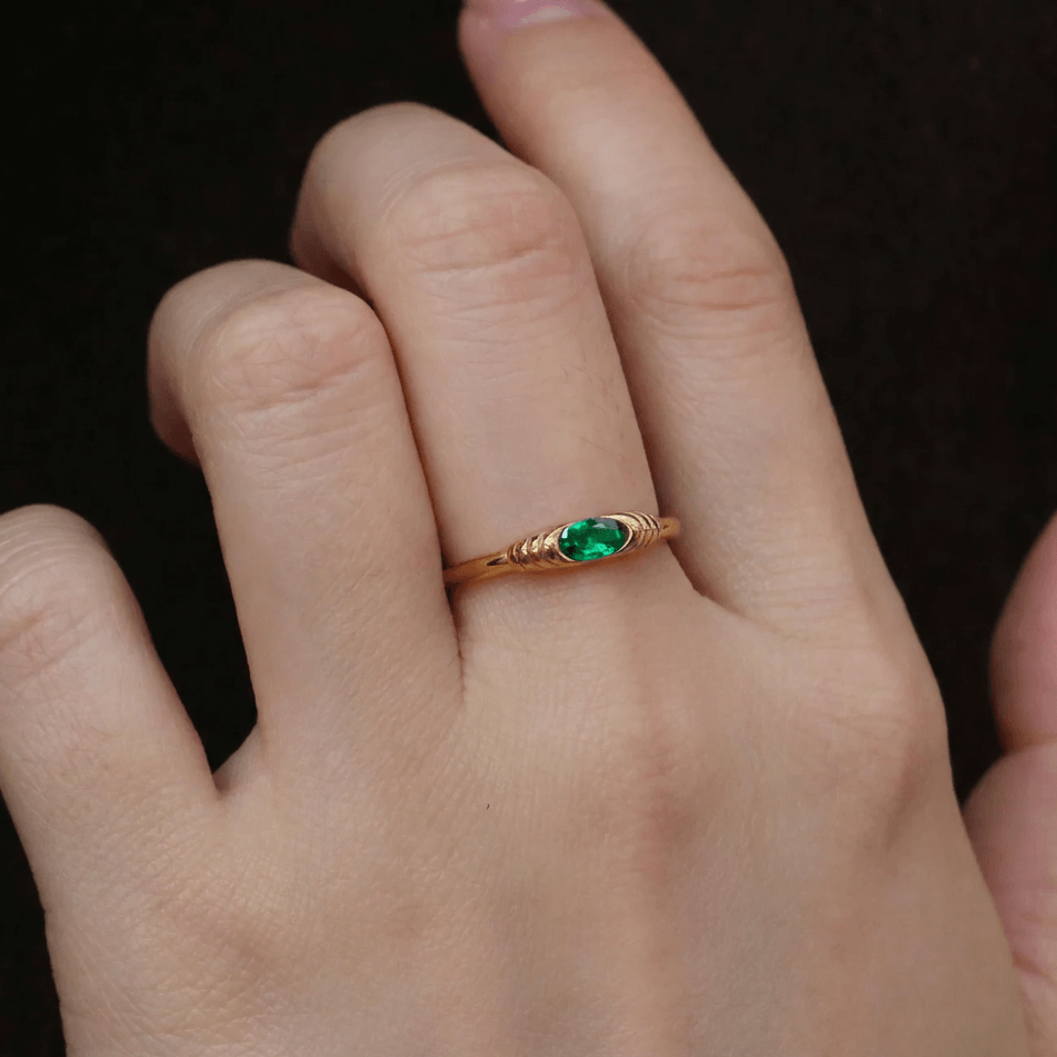 gold ring with green stone