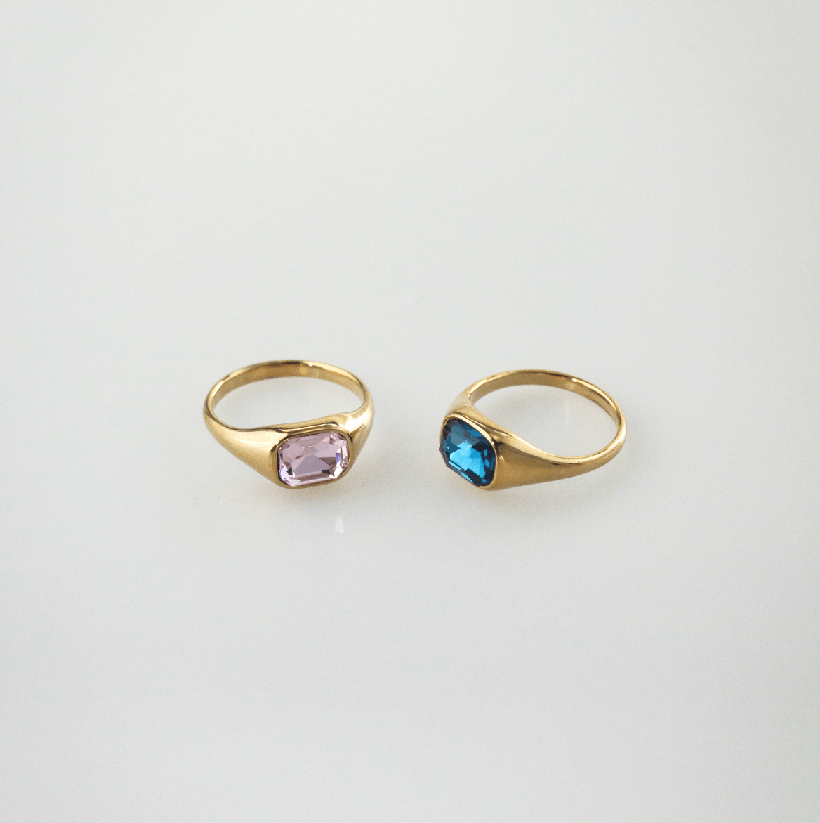 pink and blue emerald cut ring