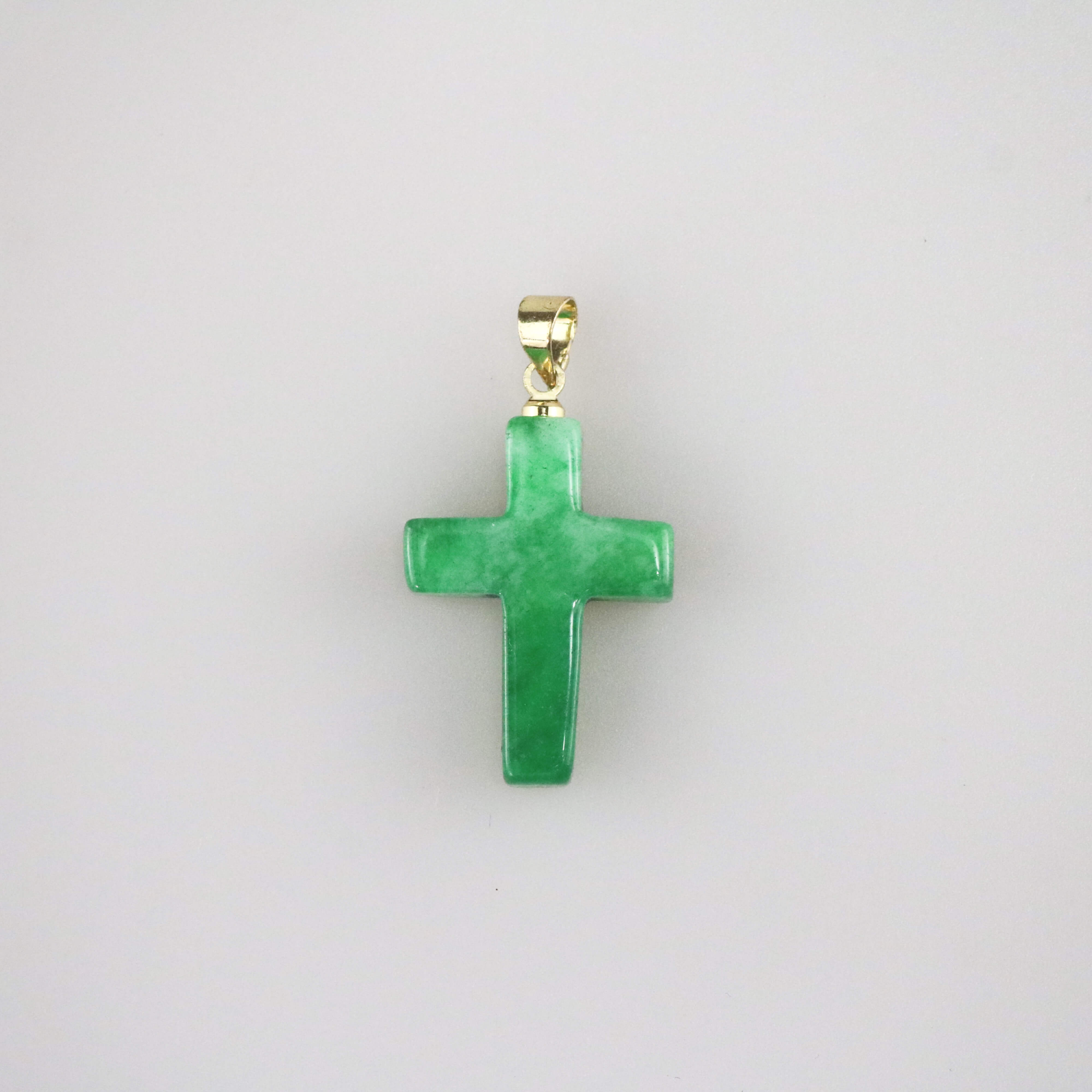 jade cross pendant in green color, cross that is made with jade