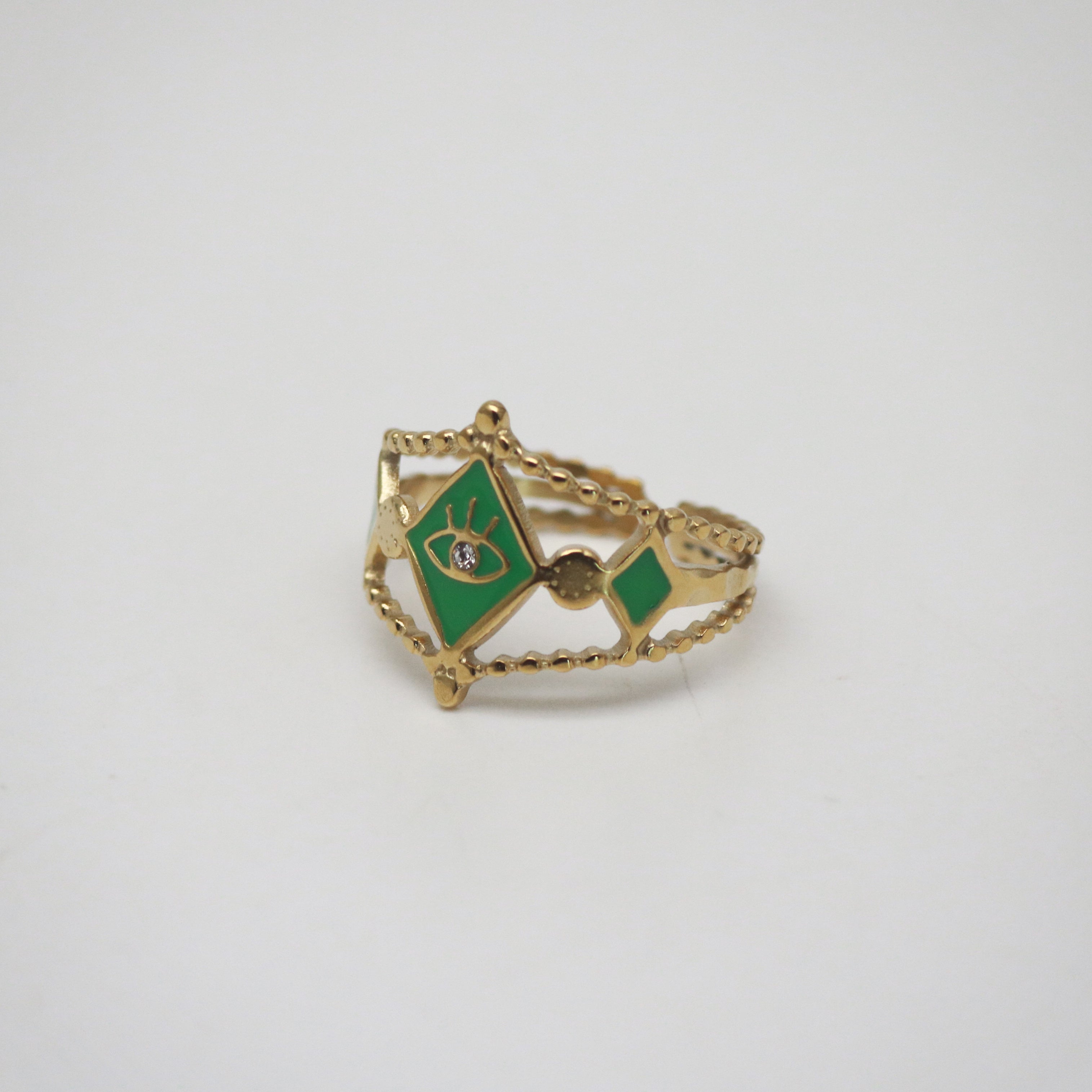 boho evil eye ring with green enamel