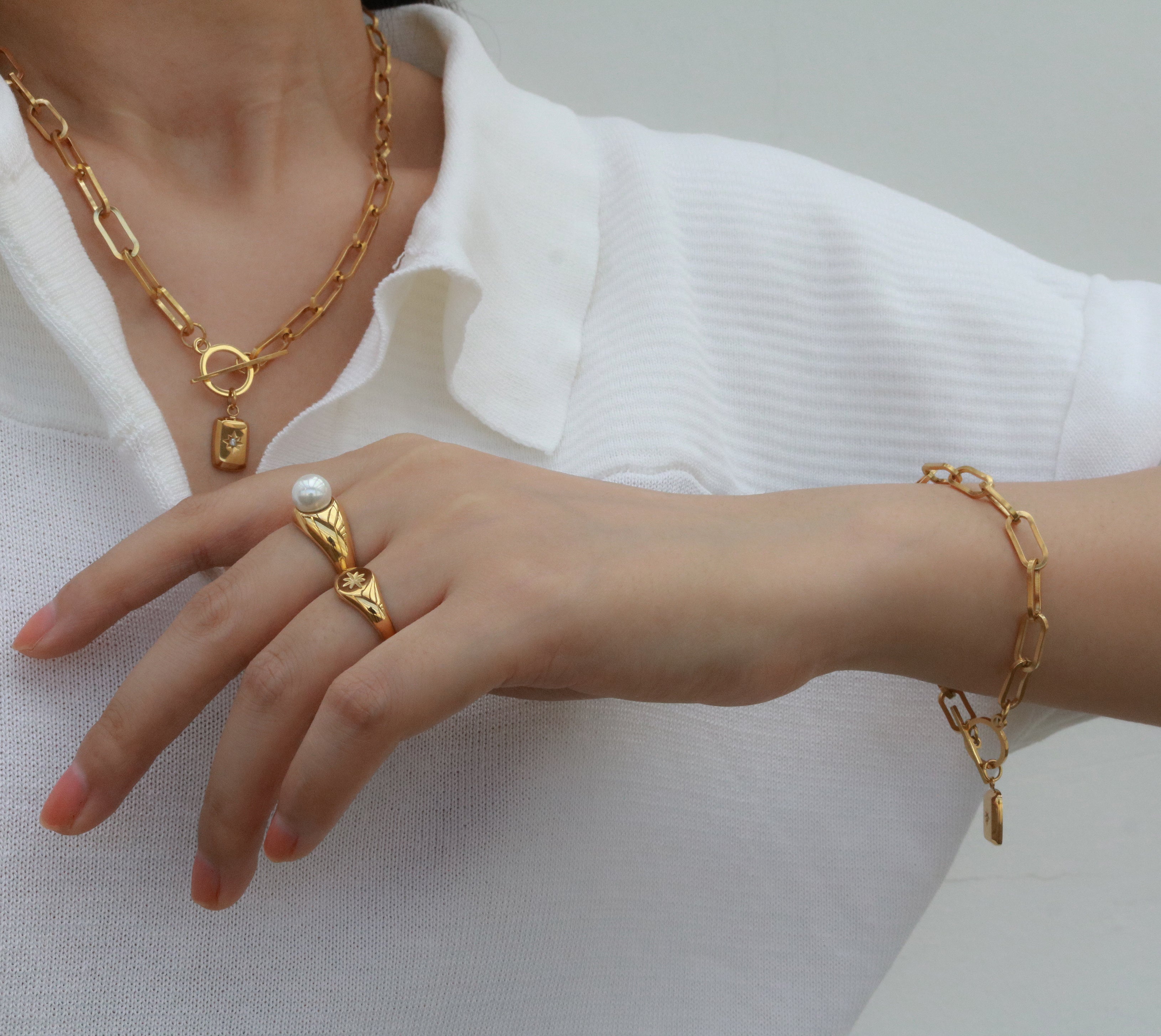 gold bracelet and gold rings