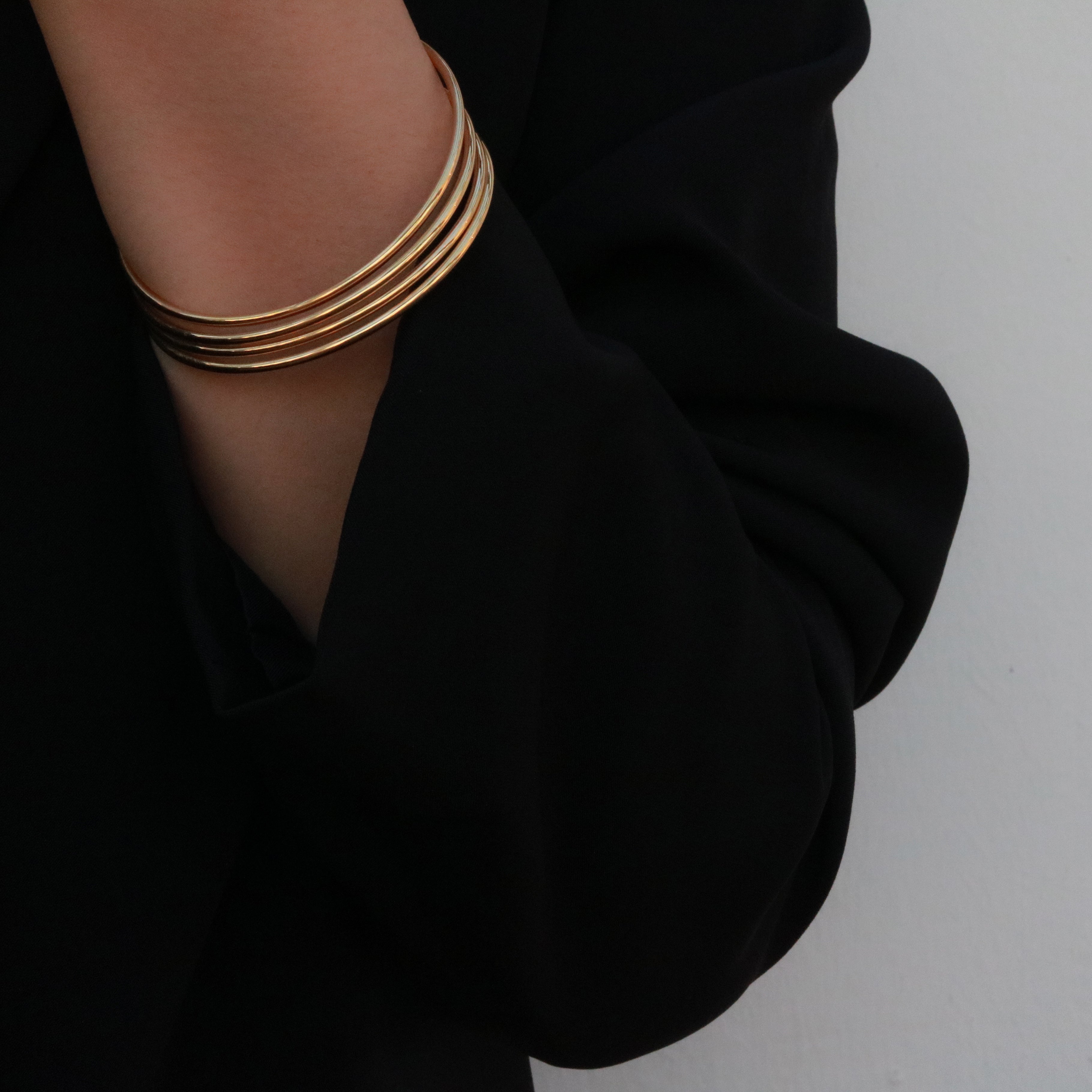 stacked gold bangles