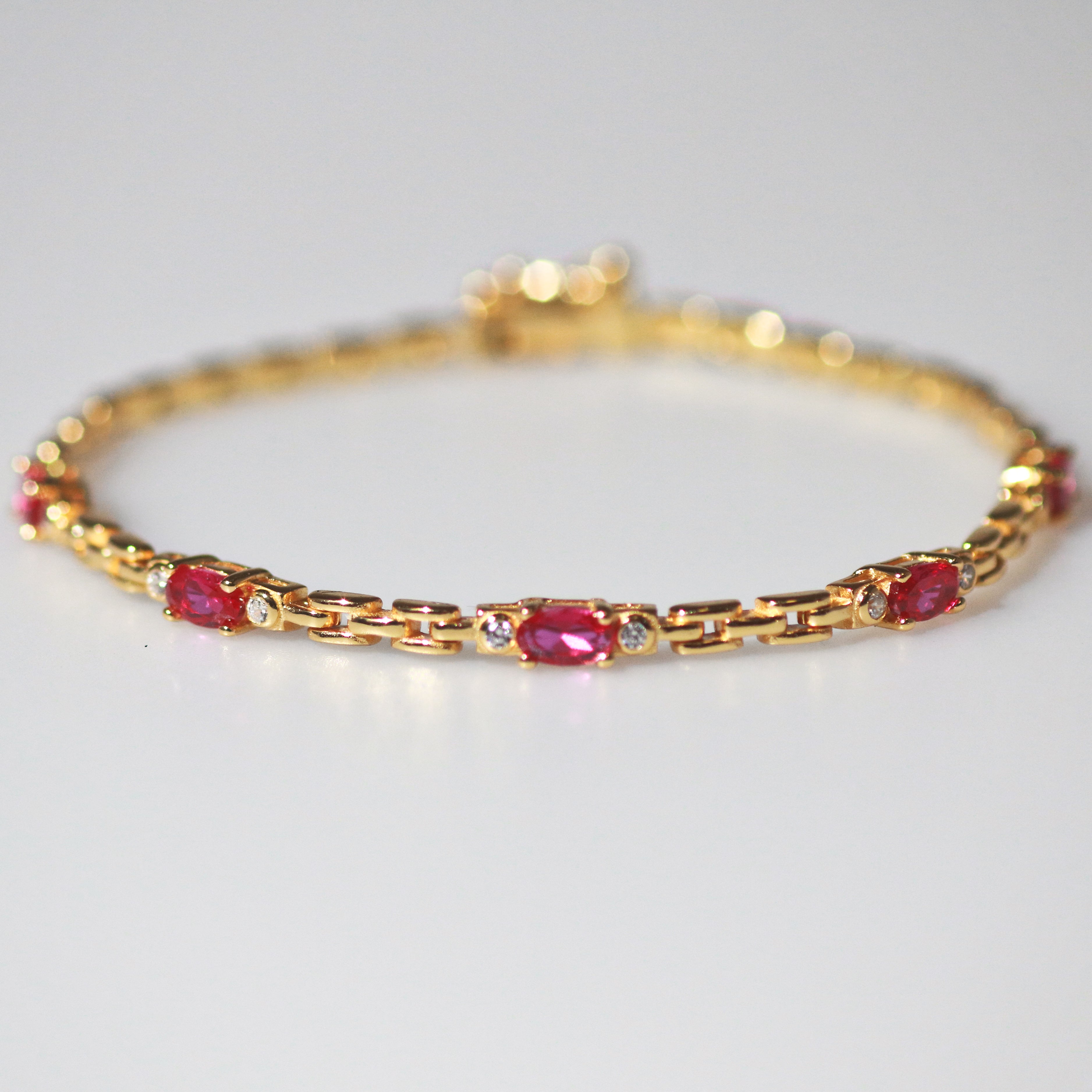 Meideya Jewelry Gold vermeil garnet bracelet with watch strap design
