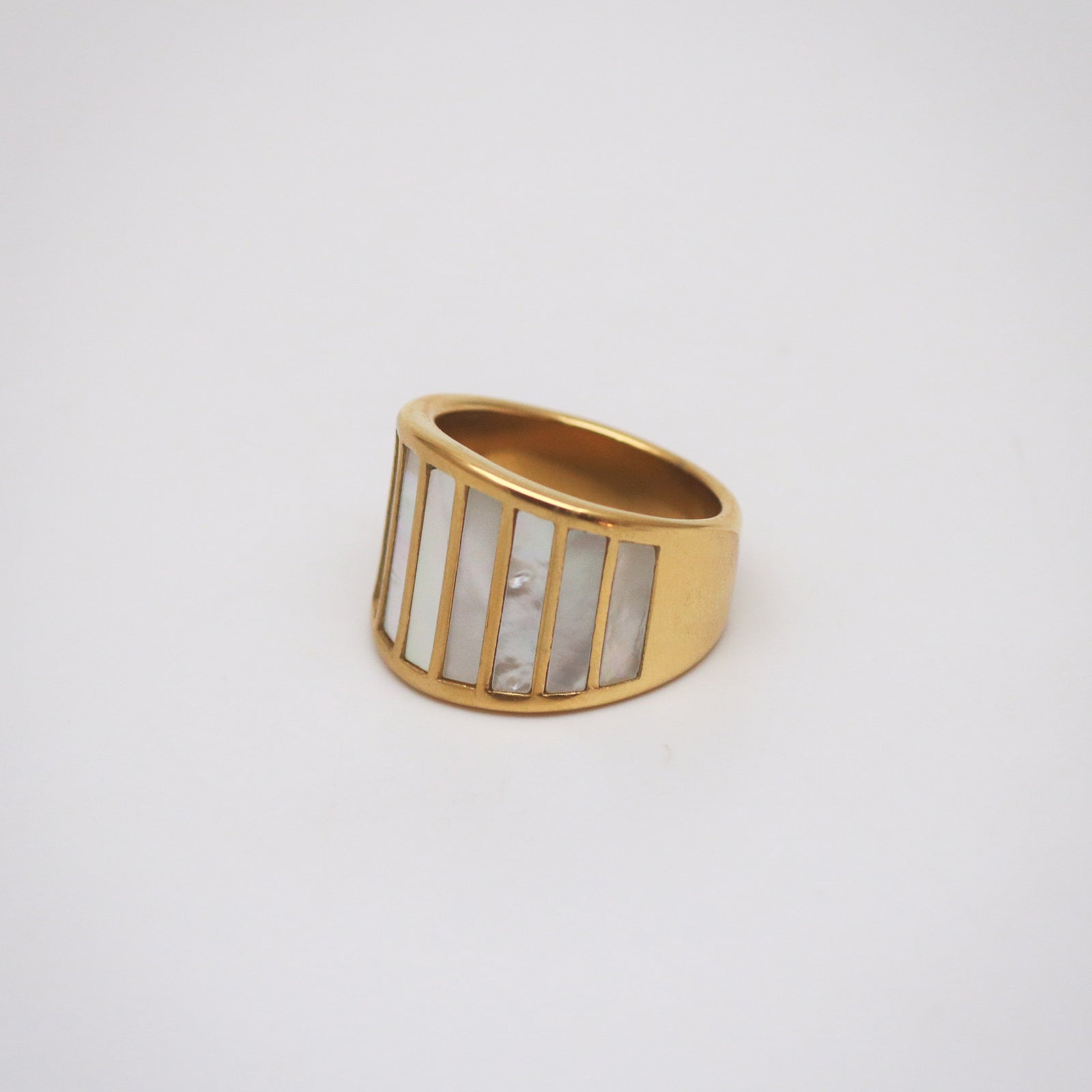 gold stainless steel ring with striped mother of pearl