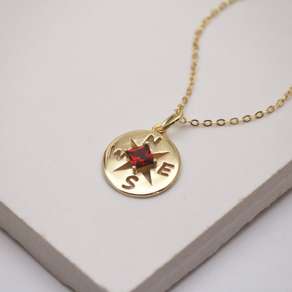 compass pendant necklace with ruby gemstone